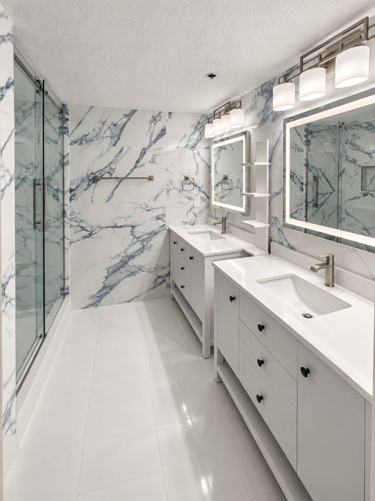 Master bath remodel with blue marble tile and double vanity